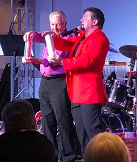 Laughs with a spectator at a club gig. Magical comedian for Wollongong and illawarra